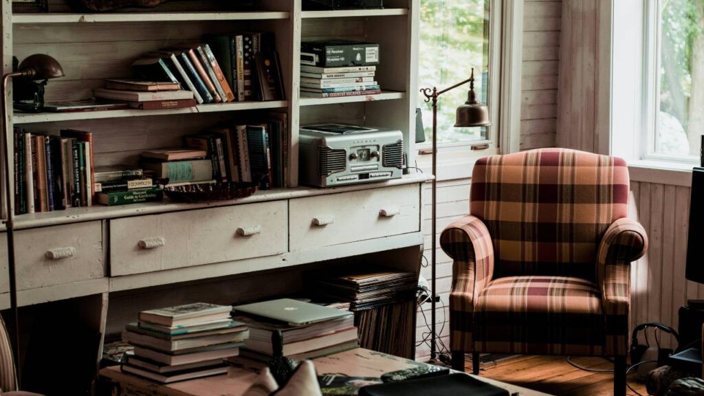 An armchair in a comfortable room with books