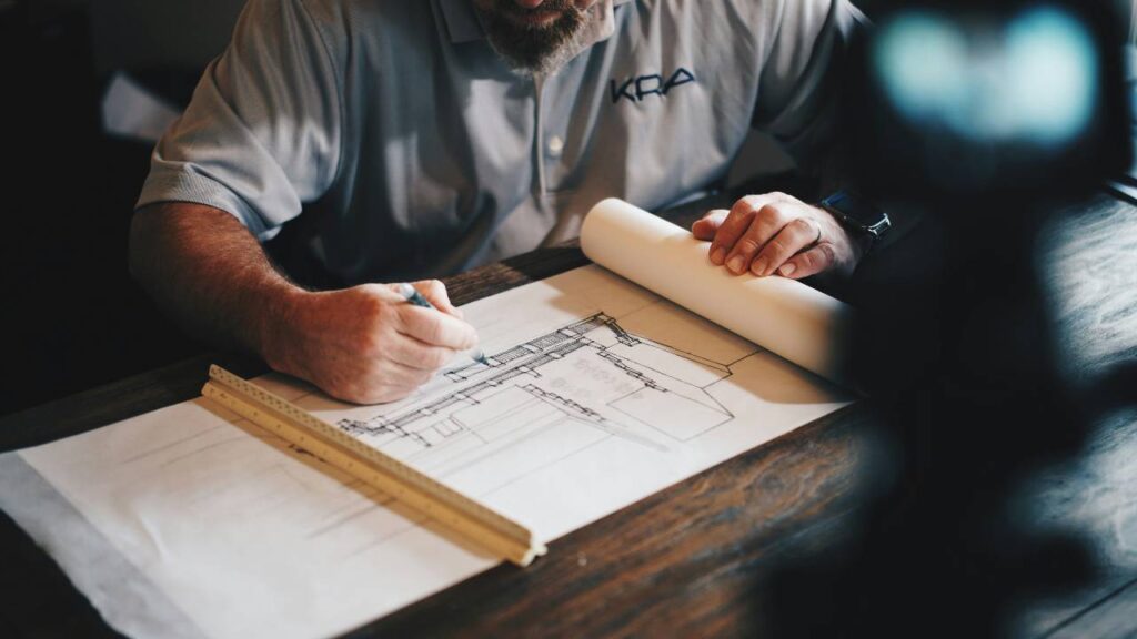 A photo of a man working on an architectural project
