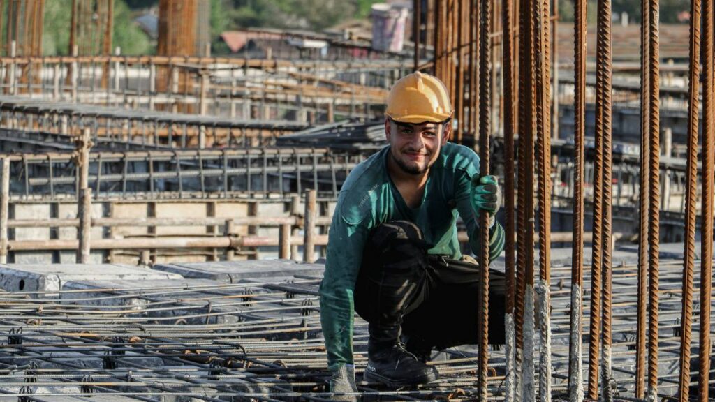 A construction worker looking at the camera