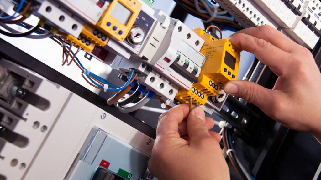 Person conducting an inspection of an electrical installation 