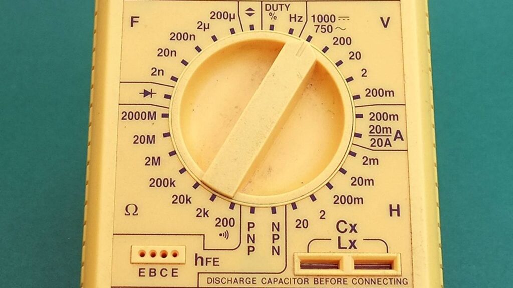 A dial of a yellow multimeter